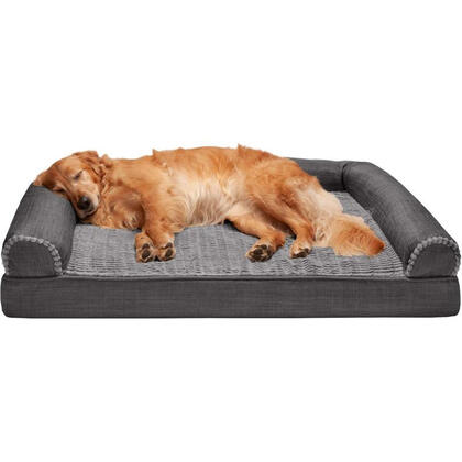 Golden retriever sleeping like royalty on charcoal orthopedic dog sofa bed.
