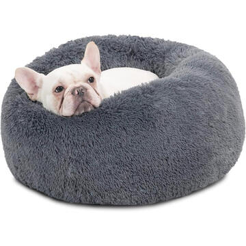 French bulldog snuggled inside a fluffy grey donut calming dog bed